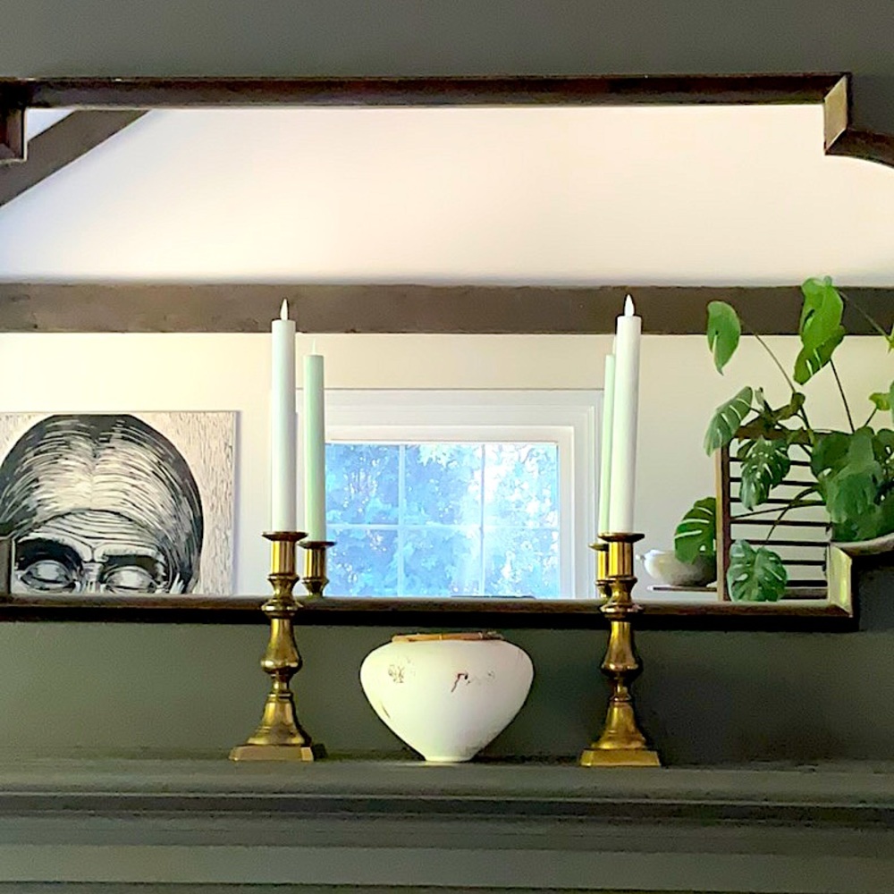 A pair of antiqued brass candles sticks.